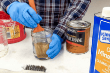 Cleaning a paintbrush with thinners for DIY and professional painting projects