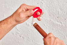 Wrapping PTFE plumbing tape around a pipe for leak-proof connections