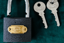 Hands holding cabinet keys from NSJ wholesaler providing secure access solutions